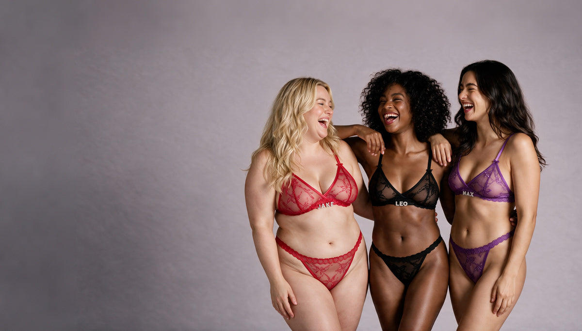 Three friends laughing in lace sets personalised with names in rhinestone letters