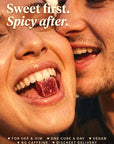 Couple laughing cheek to cheek, a Desire Cube on her tongue: sweet first, spicy after. For her and him, one cube a day, vegan, no caffeine, discreet delivery